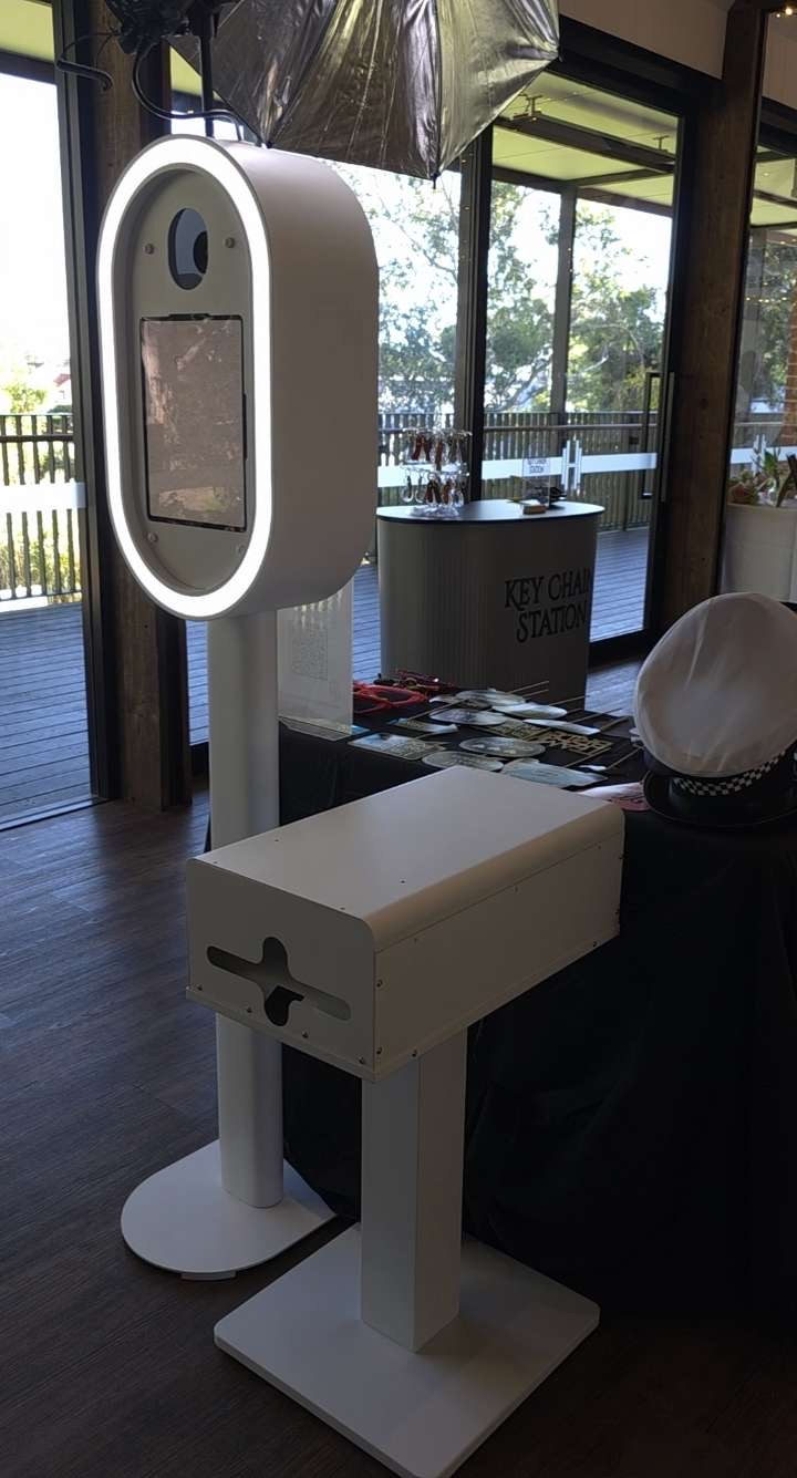 The Luxe photo booth set up at an Adelaide venue with ring light, instant printer and a prop table